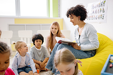 Woman reading to children